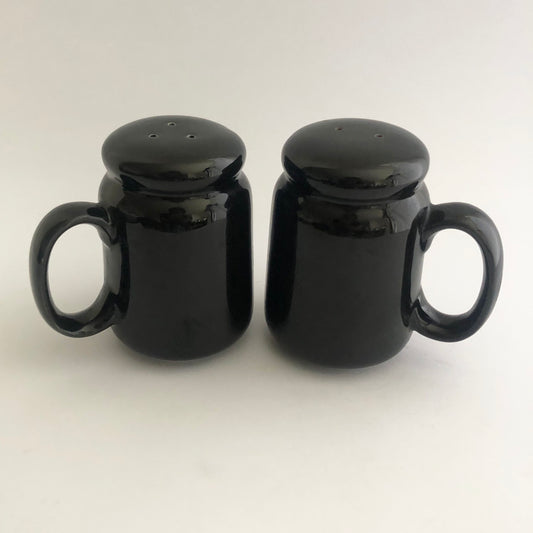 Vintage black salt and pepper shakers