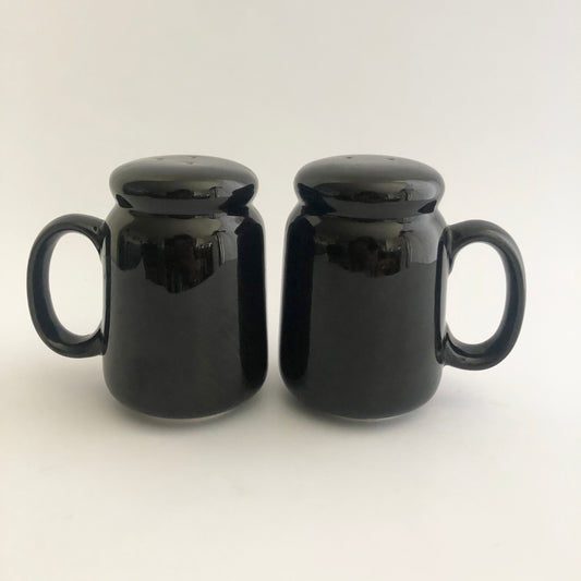 Vintage black salt and pepper shakers